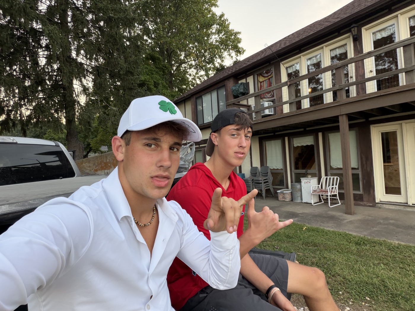 Thomas Mackin and a fellow crew member sitting outside after a day of work